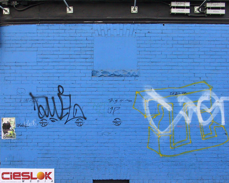 Random graffiti on a blue wall